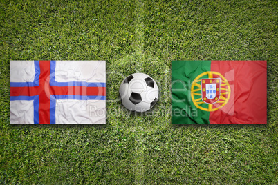 Faeroe Islands vs. Portugal flags on soccer field