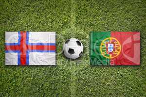 Faeroe Islands vs. Portugal flags on soccer field