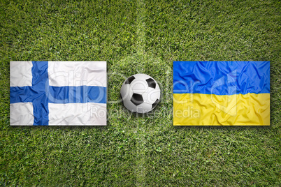 Finland vs. Ukraine flags on soccer field
