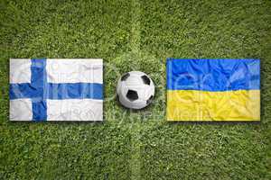 Finland vs. Ukraine flags on soccer field