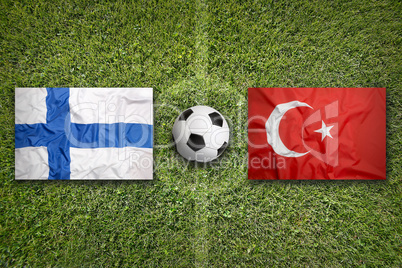 Finland vs. Turkey flags on soccer field
