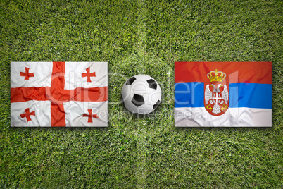 Georgia vs. Serbia flags on soccer field