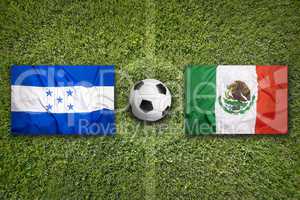 Honduras vs. Mexico flags on soccer field