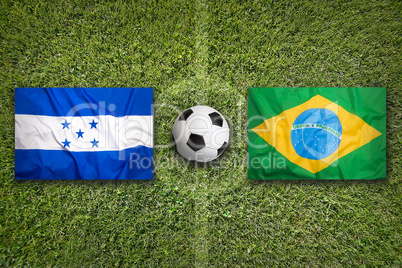 Honduras vs. Brazil flags on soccer field