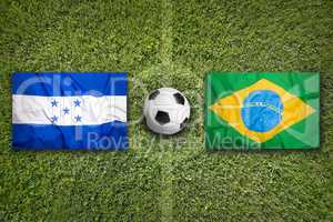 Honduras vs. Brazil flags on soccer field