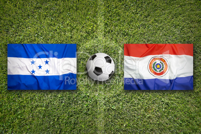Honduras vs. Paraguay flags on soccer field
