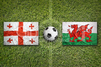 Georgia vs. Wales flags on soccer field