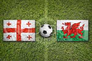 Georgia vs. Wales flags on soccer field