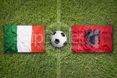 Italy vs. Albania flags on soccer field
