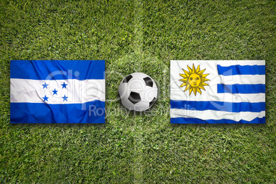 Honduras vs. Uruguay flags on soccer field
