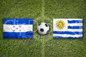 Honduras vs. Uruguay flags on soccer field