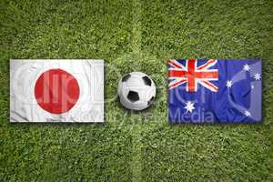 Japan vs. Australia flags on soccer field