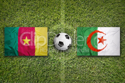 Cameroon vs. Algeria flags on soccer field