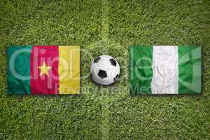Cameroon vs. Nigeria flags on soccer field