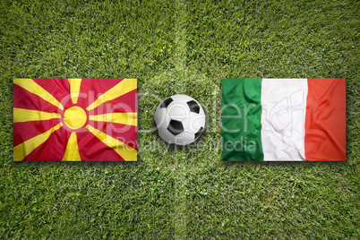 Macedonia vs. Italy flags on soccer field