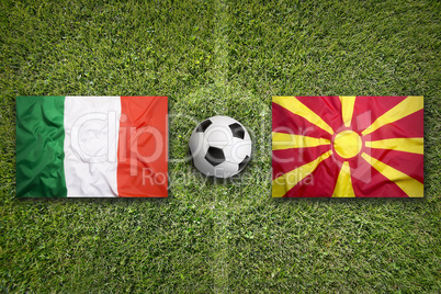 Italy vs. Macedonia flags on soccer field