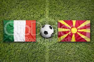 Italy vs. Macedonia flags on soccer field