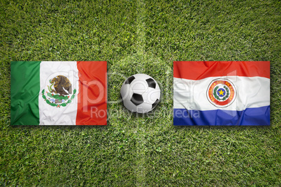 Mexico vs. Paraguay flags on soccer field