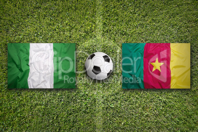 Nigeria vs. Cameroon flags on soccer field
