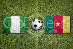 Nigeria vs. Cameroon flags on soccer field