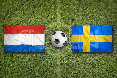 Netherlands vs. Sweden flags on soccer field