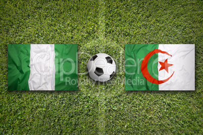 Nigeria vs. Algeria flags on soccer field