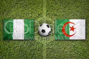Nigeria vs. Algeria flags on soccer field