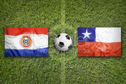 Paraguay vs. Chile flags on soccer field