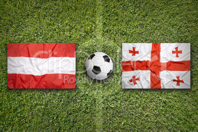 Austria vs. Georgia flags on soccer field