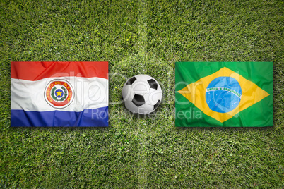 Paraguay vs. Brazil flags on soccer field
