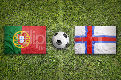 Portugal vs. Faeroe Islands flags on soccer field