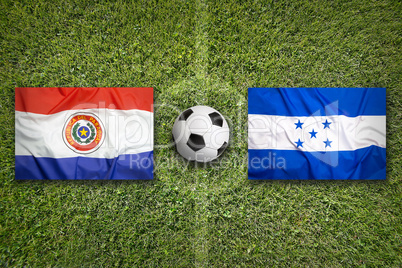 Paraguay vs. Honduras flags on soccer field