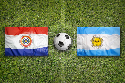 Paraguay vs. Argentina flags on soccer field