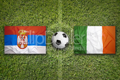 Serbia vs. Ireland flags on soccer field