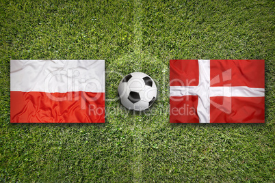 Poland vs. Denmark flags on soccer field