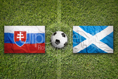 Slovakia vs. Scotland flags on soccer field