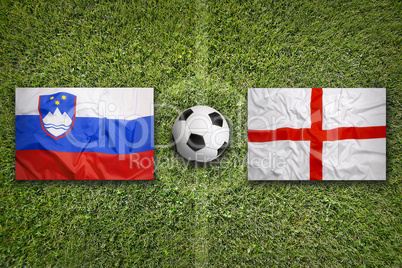 Slovenia vs. England flags on soccer field