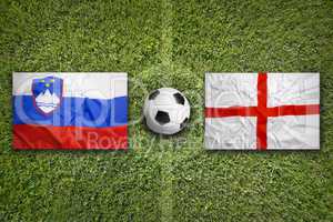 Slovenia vs. England flags on soccer field