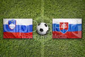 Slovenia vs. Slovakia flags on soccer field