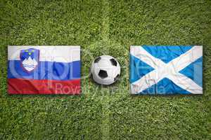 Slovenia vs. Scotland flags on soccer field