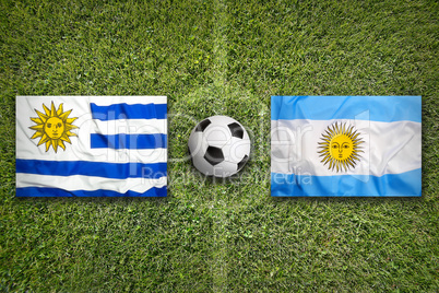 Uruguay vs. Mexico flags on soccer field