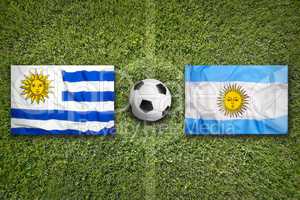 Uruguay vs. Mexico flags on soccer field
