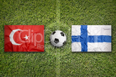 Turkey vs. Finland flags on soccer field
