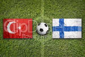 Turkey vs. Finland flags on soccer field