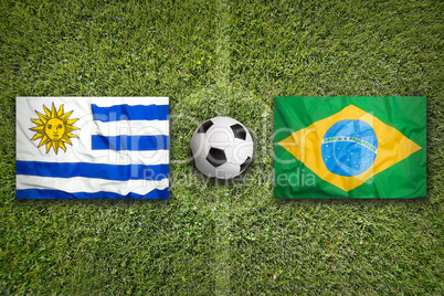 Uruguay vs. Brazil flags on soccer field