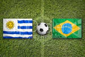 Uruguay vs. Brazil flags on soccer field