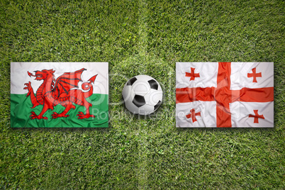 Wales vs. Georgia flags on soccer field