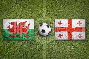 Wales vs. Georgia flags on soccer field