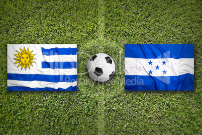 Uruguay vs. Honduras flags on soccer field