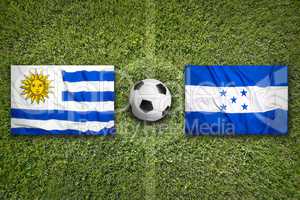 Uruguay vs. Honduras flags on soccer field